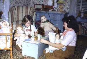 Connie and Carol having a tea party with our dolls