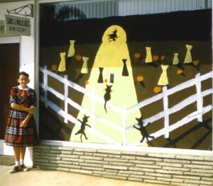 Connie in front of her 1st place window painting at age 11